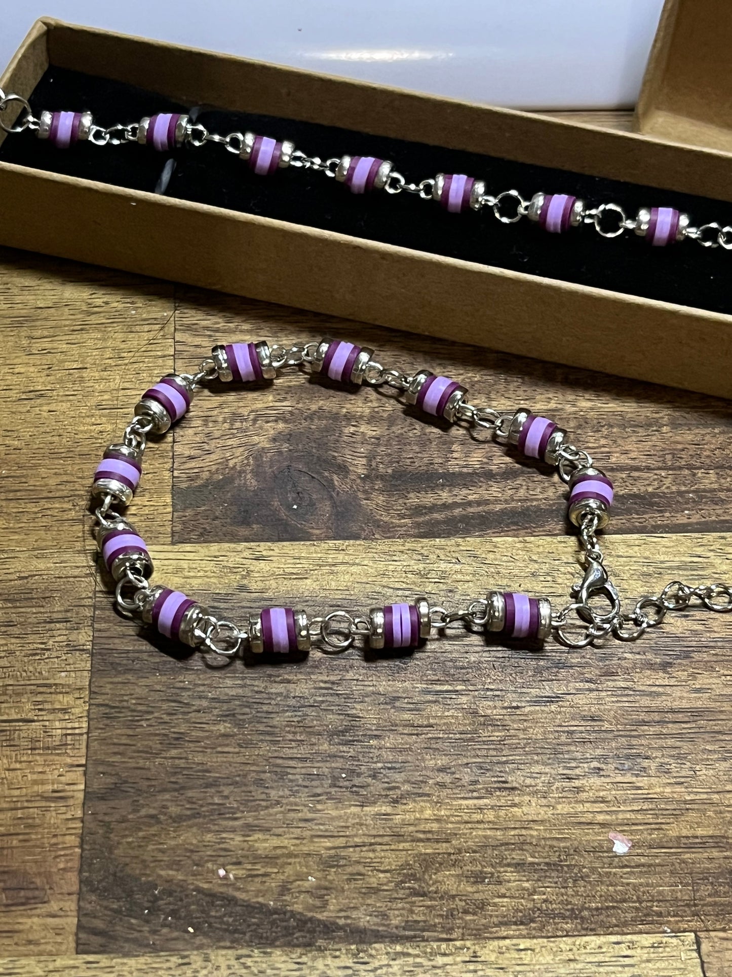 Necklace with purple beads and silver chain