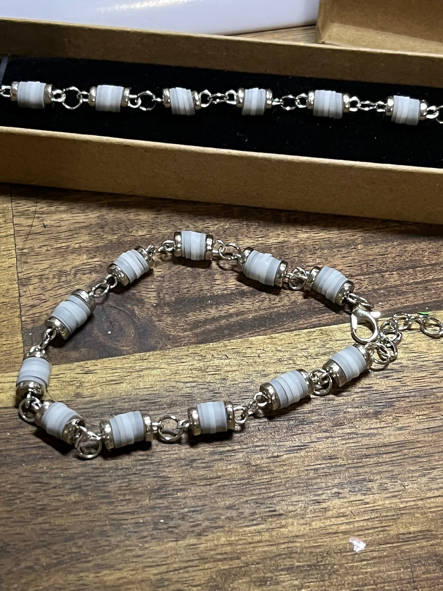 Necklace with gray beads and silver chain
